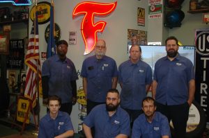 Image #2 of Mechanics and Automotive Technicians in lobby of Ross Tire & Service in Lafayette, LA
